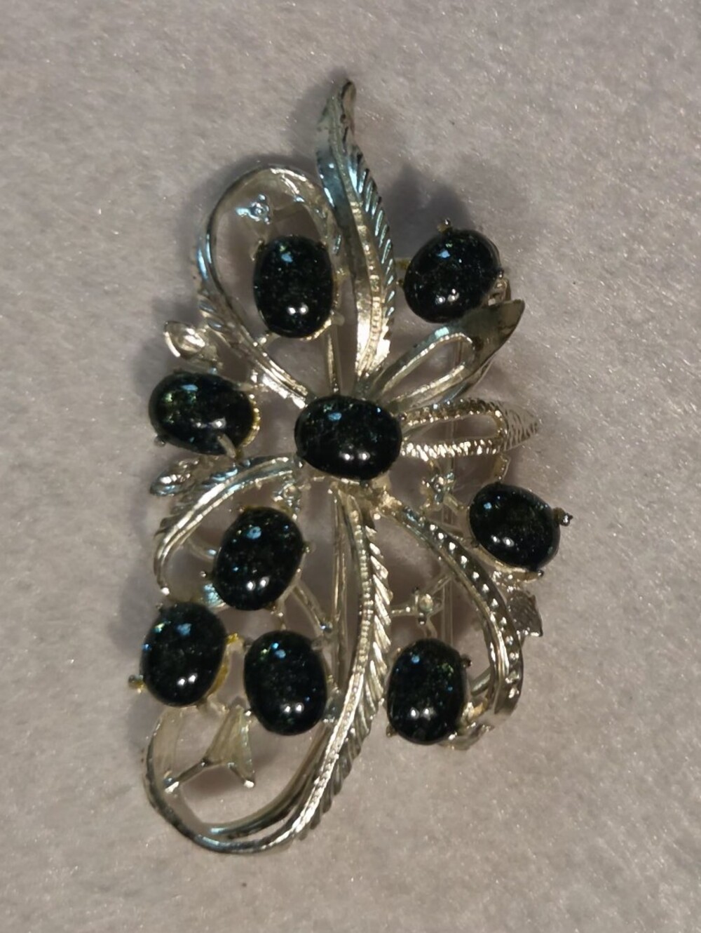 Vintage Silver-Tone Floral Brooch with Dark Teal Cabochons